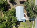 An aerial view of the home's roof surrounded by lush green trees at 4688 Maraldo Ave, North Port, FL 34287