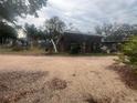 Rustic home featuring a unique stone facade and natural surroundings at 3016 17Th St., Sarasota, FL 34234