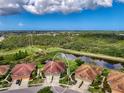 Aerial view of a single-Gathering home with a pond in the backyard at 371 Capulet Dr, Venice, FL 34292
