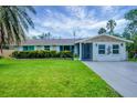 Charming single-story home with a well-manicured lawn and refreshed exterior paint, reflecting pride of ownership at 386 Nightingale Rd, Venice, FL 34293