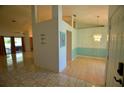 Bright dining area boasts a modern light fixture, and flows into an adjacent living space creating an open floor plan at 505 Duke Rd, Venice, FL 34293