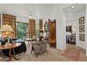 Cozy living room with stylish furnishings and a screened balcony at 5134 Northridge Rd # 303, Sarasota, FL 34238
