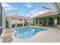 Gorgeous screened-in pool area with a large, inviting pool and plenty of space for outdoor entertaining at 6619 Pinefeather Ct, Bradenton, FL 34203