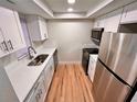 Efficient kitchen featuring stainless steel appliances, sleek countertops, and modern cabinetry at 7201 Daiquiri Ln, Tampa, FL 33634