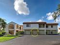 Two story condo featuring attached garages and well maintained landscaping at 800 Capri Isles Blvd # 235, Venice, FL 34292