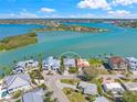 Expansive aerial view capturing the home's waterfront location with views of the open bay and surrounding islands at 931 Inlet Cir, Venice, FL 34285