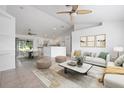 Bright, open-concept living room flows into the kitchen and dining area, perfect for modern living and entertaining at 2397 Morton Rd, North Port, FL 34291