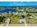 Wide aerial view of the neighborhood and nearby canal system at 20430 Edgewater Dr, Port Charlotte, FL 33952