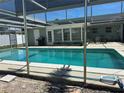 Inviting screened-in pool area, perfect for outdoor relaxation and entertaining with an adjacent patio at 232 Fiesole St, Venice, FL 34285