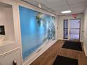Hallway features attractive flooring and artwork at 3730 Cadbury Cir # 703, Venice, FL 34293