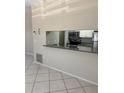 Kitchen area with granite countertops, stainless steel appliances, and an opening to the living room at 3862 59Th W Ave # 4180, Bradenton, FL 34210
