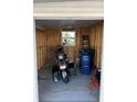 Spacious storage room with raw studs and a view from the window, providing versatile usage options at 411 Vasto Dr, Venice, FL 34285