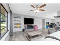 Spacious living room with ceiling fan, modern flooring, and comfortable layout at 4227 Blossom Rd, Venice, FL 34293