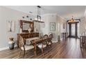 Elegant dining room featuring a wooden table, decorative mirror, and stylish accents at 4260 Wordsworth Way, Venice, FL 34293