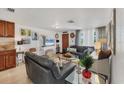 Bright living room showcasing neutral tones, modern furnishings, and an open layout concept at 1222 Pinebrook Way, Venice, FL 34285