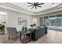 Inviting living room with plush seating, accent pillows, and a view of the outdoor patio at 2396 Caraway Dr, Venice, FL 34292