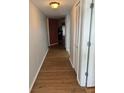 Long hallway with wood-look floors at 3310 Loveland Blvd # 1406, Punta Gorda, FL 33980