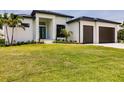 Modern two-story home with a two-car garage and beautifully landscaped yard at 24194 Peppercorn Rd, Punta Gorda, FL 33955