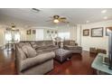 Spacious living room with hardwood floors and comfortable sectional sofa at 10178 118Th Ave, Largo, FL 33773