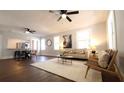 Bright and airy living room with hardwood floors, neutral decor, and ample natural light at 922 E Ida St, Tampa, FL 33603