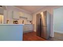 Modern kitchen featuring stainless steel appliances and light blue cabinetry at 922 E Ida St, Tampa, FL 33603