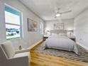 Bedroom with a bed, nightstands and an armchair at 865 Everest Rd, Venice, FL 34293