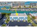 Aerial view of three-unit building near marina at 12550 Capri N Cir # 3, Treasure Island, FL 33706
