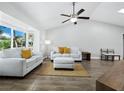Living room with light gray sofas and tile flooring at 516 Casas Bonitas Way, Nokomis, FL 34275