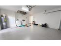 Bright garage with washer, dryer, and ample storage space at 8235 Amendola Ave, North Port, FL 34291