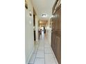 Long entryway with tile floors leading to the living area at 3610 Lake Bayshore Dr # K226, Bradenton, FL 34205