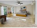 Bright main bedroom with large windows and ample space at 1200 Tarpon Woods Blvd # S2, Palm Harbor, FL 34685