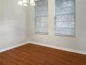 Simple dining room with hardwood floors and neutral walls at 8928 Red Beechwood Ct, Riverview, FL 33578