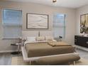 Spacious main bedroom with a king-size bed and calming decor at 8928 Red Beechwood Ct, Riverview, FL 33578