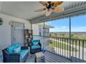 Comfortable screened porch with ocean view, perfect for relaxing and enjoying the scenery at 7442 Palm Island Dr # 3624, Placida, FL 33946