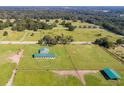 Aerial view of farm with barn and riding area at 37600 Largo Ln, Dade City, FL 33523