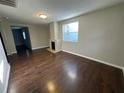 Living room with hardwood floors and a built-in fireplace at 515 E Morgan St, Tarpon Springs, FL 34689