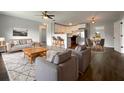 Spacious open-concept living room and kitchen with hardwood floors, new appliances and lots of natural light at 4011 Mesa Ave, Sarasota, FL 34233
