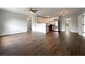 Spacious open-concept living room and kitchen with hardwood floors, new appliances and lots of natural light at 4011 Mesa Ave, Sarasota, FL 34233