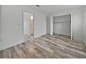 Spacious bedroom with wood-look floors and a large closet at 525 Manatee Ct # 14, Venice, FL 34285