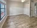 Bright bedroom with new flooring and closet at 3184 Wessex Way, Clearwater, FL 33761