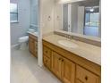 Bathroom with double vanity and updated fixtures at 3184 Wessex Way, Clearwater, FL 33761