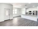 Modern kitchen with white cabinets, granite counters and stainless steel appliances at 368 Munoz St, Port Charlotte, FL 33953
