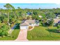 Aerial view of a house with a large yard and neighborhood at 368 Munoz St, Port Charlotte, FL 33953