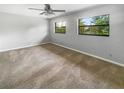 Bright bedroom with ceiling fan and lots of natural light from two windows at 3421 S Carter St # C, Tampa, FL 33629
