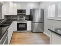 Modern kitchen with stainless steel appliances, granite countertops and ample cabinet space at 3421 S Carter St # C, Tampa, FL 33629