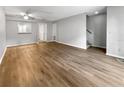 Spacious living room featuring modern wood flooring and neutral paint throughout at 3421 S Carter St # C, Tampa, FL 33629