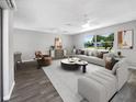 Bright living room with stylish furniture and hardwood floors at 1019 Deer Run, Venice, FL 34293