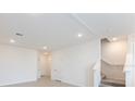 Open living area with stairs, neutral walls and recessed lighting at 17339 Peregrine Way, Punta Gorda, FL 33982