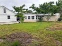 Large backyard with detached garage and home at 1620 Lakeview Pl, Englewood, FL 34223