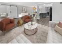 Bright living room featuring stylish furniture and hardwood floors at 4104 W Gray St, Tampa, FL 33609